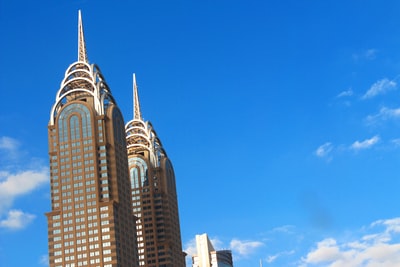 Brown concrete building under the blue sky during the day
